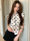 KYLETHOMASW  -  Polka dot short sleeved breasted shirt design with a cinched waist and tie, light and mature satin short commuter top