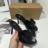 KYLETHOMASW  -  Summer New Korean Version Temperament Sexy Niche Design thin heel Open Toe one-word Bow Slippers Women's high-heeled Outerwear