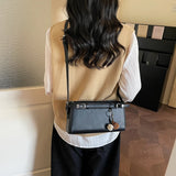 KYLETHOMASW  -  Women's Soft Leather Crossbody Bag Pom Pom Charm Decor Adjustable Strap Minimalist Elegant Commuter Daily Shoulder Bag