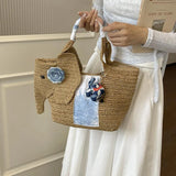 KYLETHOMASW  -  Cute Elephant Shape Straw Tote Bag Hand Woven Beach Bag With Blue Floral Decor Mini Elephant Pendant Handheld Shoulder Bag