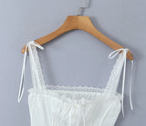 KYLETHOMASW  -  White Spliced Lace Slash Collar Ribbon Bow Strap Summer Corset Women Summer Tank Tops Pleated Slim Through Buttons Crop Top