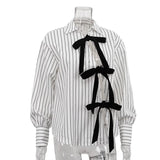 KYLETHOMASW  -  Niche Design Lace-up Printed Striped Shirt for Women Autumn New Lapel Long-sleeved Cardigan Versatile Top