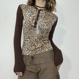 KYLETHOMASW  -  European and American leopard print five claw buckle design, shoulder length long sleeved personalized retro hooded short top